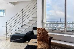 Duplex on the top floors with exceptional views of Paris and no overlooked neighbors