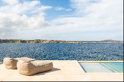 Exquisite beachfront residence available for rent in Menorca.