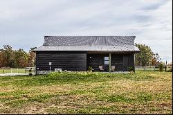 Charming Carriage House, Spacious Workshop with Acreage Await