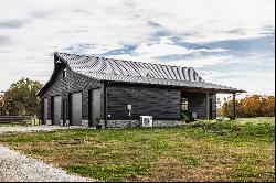 Charming Carriage House, Spacious Workshop with Acreage Await