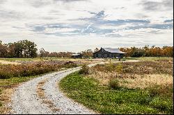 Charming Carriage House, Spacious Workshop with Acreage Await