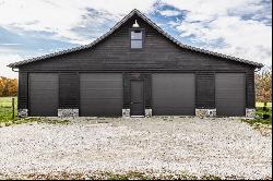 Charming Carriage House, Spacious Workshop with Acreage Await