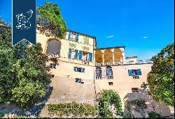 Prestigious frescoed castle with a grand ballroom and tennis court for sale in Loano