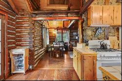 Two turn of the century charming cabins nestled in towering pines