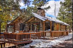 Two turn of the century charming cabins nestled in towering pines