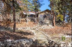 Two turn of the century charming cabins nestled in towering pines