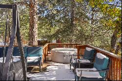 Two turn of the century charming cabins nestled in towering pines