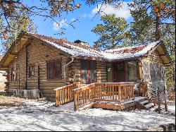 Two turn of the century charming cabins nestled in towering pines