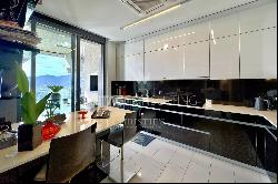 Lugano-Aldesago: modern penthouse apartment for sale with stunning lake views, rooftop te