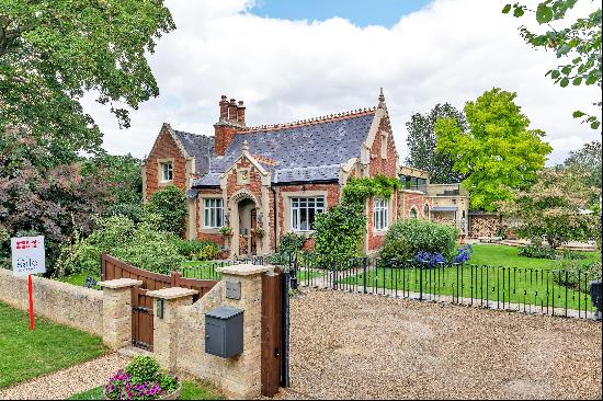 Nestled in a picturesque hamlet south east of the city, this exceptional school conversion