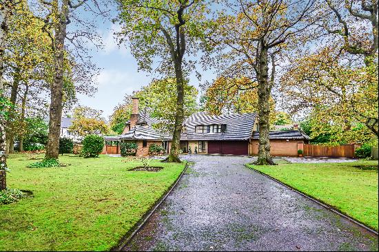 A superb family home set in 0.93 acres of private wrap around gardens, in a very desirable