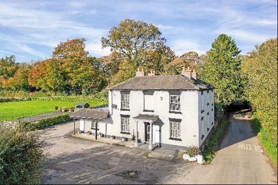 A highly specified country home set in close to 1 acre of grounds with outstanding views.