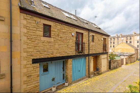 Three storey Mews house with four bedrooms, private garden and garage.