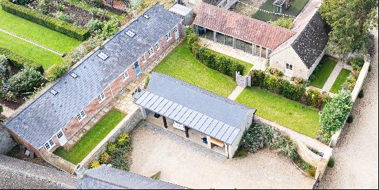 A recently converted barn and potting shed which formed part of the estate yard to Hathero