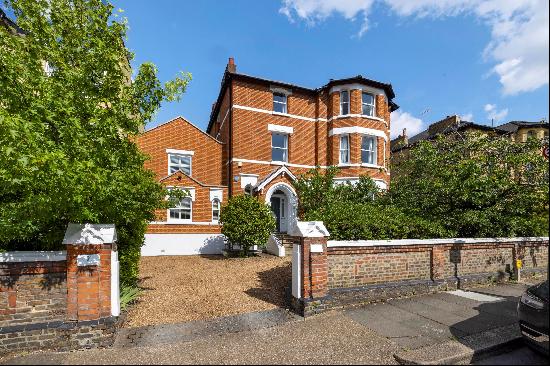 A substantial detached family home of impressive proportions with a large garden,  ample p