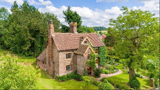 A charming Grade II listed 17th century farmhouse with a large garden set on the outskirts