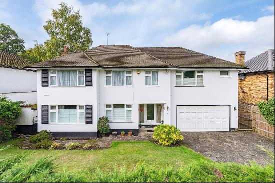 A superb five bedroom detached house with a west facing garden near Reed's School and Oxsh