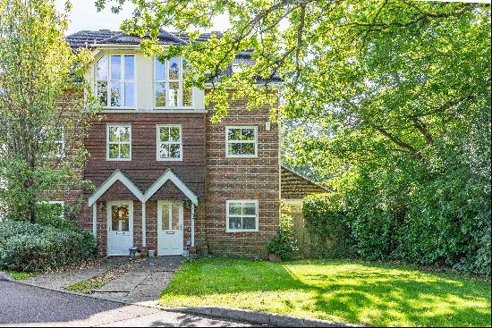 An impressive four bedroom house located in a popular gated development near Cobham & Stok