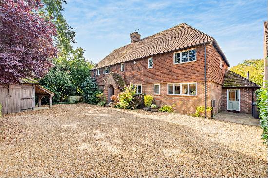 A detached five bedroom family home located at the heart of Shamley Green, within walking 