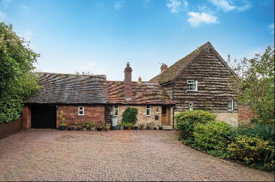 A charming four-bedroom cottage in a beautiful countryside setting with good access to War