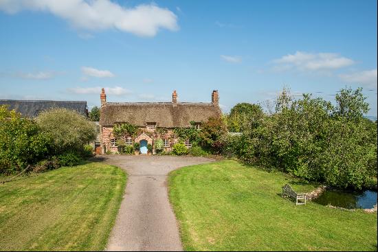 A characterful 13th century farmhouse off a little-used lane with an annexe, equestrian fa