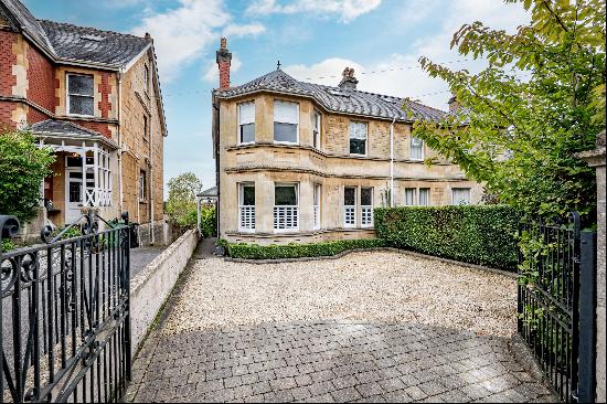 A semi-detached six-bedroom home with gardens, garage and views, on the southern slopes of