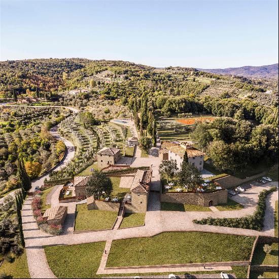 Partially restored historic villa complex dominating the hills of Southern Tuscany.