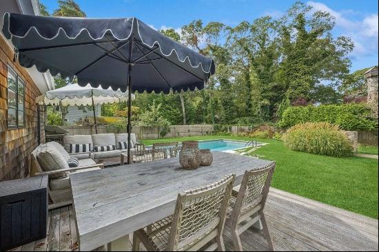 Discover this polished gem in East Hampton that exudes modern elegance and convenience. Th