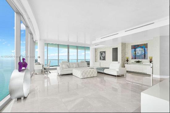 Welcome to the prestigious Estates at Acqualina, featuring a stunning NE corner unit with 