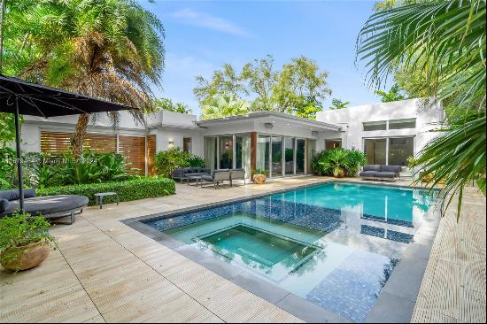 Discover a mid-century modern gem nestled in North Coconut Grove, where luxury meets comfo