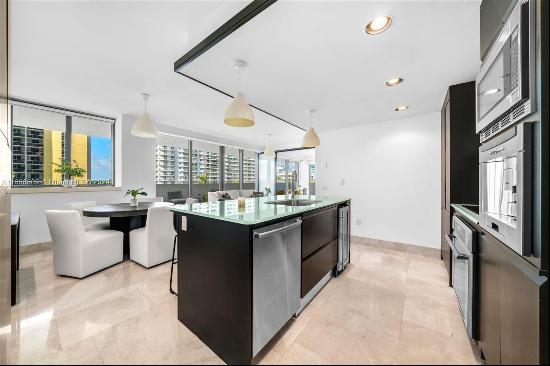 Enjoy this rarely available corner Lanai unit at the boutique MEi Miami Beach. This stunni