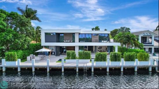 One of the most architecturally stunning custom Modern deep-water residences in guardhouse