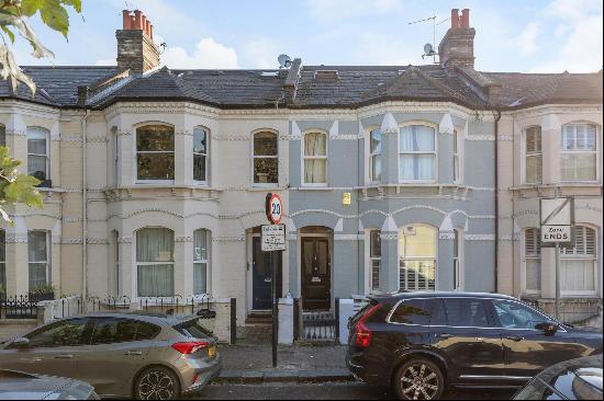 A spacious mid-terraced family home with a south-facing patio garden, located in the heart