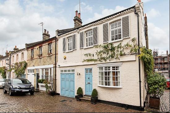 A rare opportunity to purchase a mews house with outside space and private resident parkin