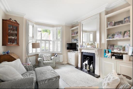 A charming three-bedroom semi-detached house, located in The Sisters, SW11.