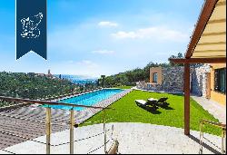 Exclusive newly renovated villa with olive grove and panoramic pool for sale near Imperia