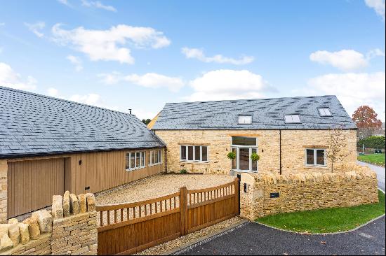 The Stirrups is a fabulous four bedroom detached Cotswold stone home with a garage, gated 