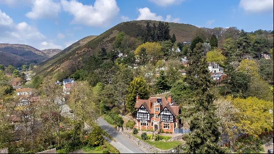 An outstanding Arts and Crafts house set on the edge of Carding Mill Valley providing supe