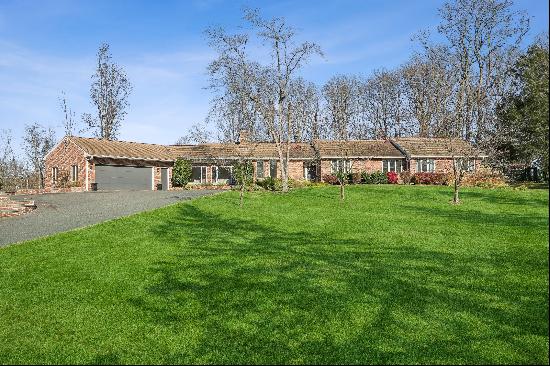 Stunning Ranch Style Home Nestled on Three Acre Property