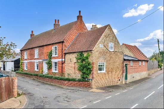 An impeccably restored Georgian Grade II listed farmhouse with historic charm and contempo