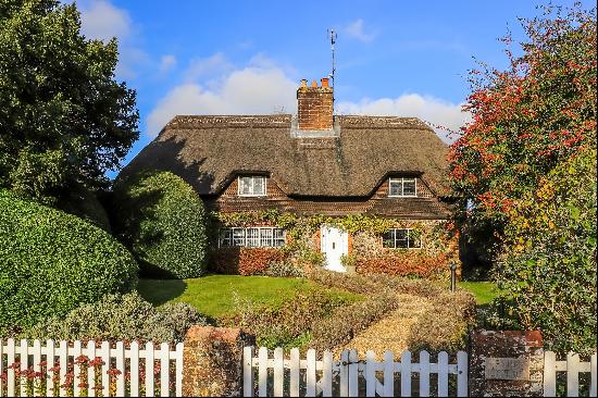 This unique Grade II listed cottage sits in the heart of the pretty village of Crawley, ab