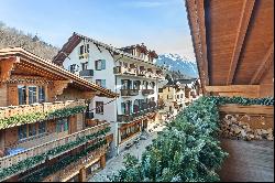 In the heart of Gstaad, luxurious top floor apartment