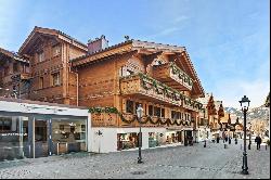 In the heart of Gstaad, luxurious top floor apartment