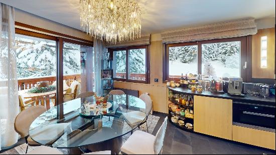 A luxury ski-in-ski-out apartment for sale in Courchevel 1850.