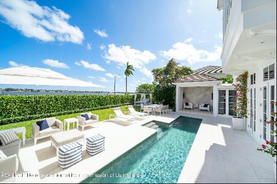 IMPRESSIVE INTRACOASTAL ESTATE INCLUDING ITS OWN PRIVATE DOCK & BOAT LIFT. Newly renovated