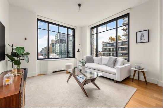 Welcome to Apartment 22E! This stunning corner two-bedroom, two-bathroom unit spans 1,1