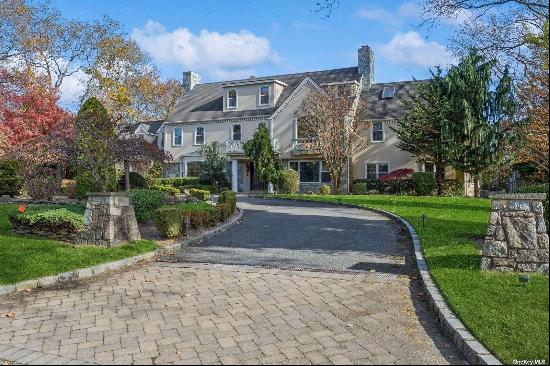 Welcome to 1315 Club Drive, this extraordinary Center Hall Colonial, gracefully set on ove