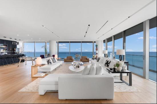 The pinnacle of luxury oceanfront living, this immaculate residence is comprised of 2 unit