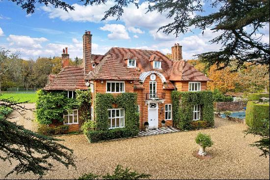 An impressive country house set within 21 acres on the edge of the sought-after village of