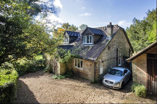 A pretty and characterful unlisted detached Sussex stone cottage occupying a quiet but ele